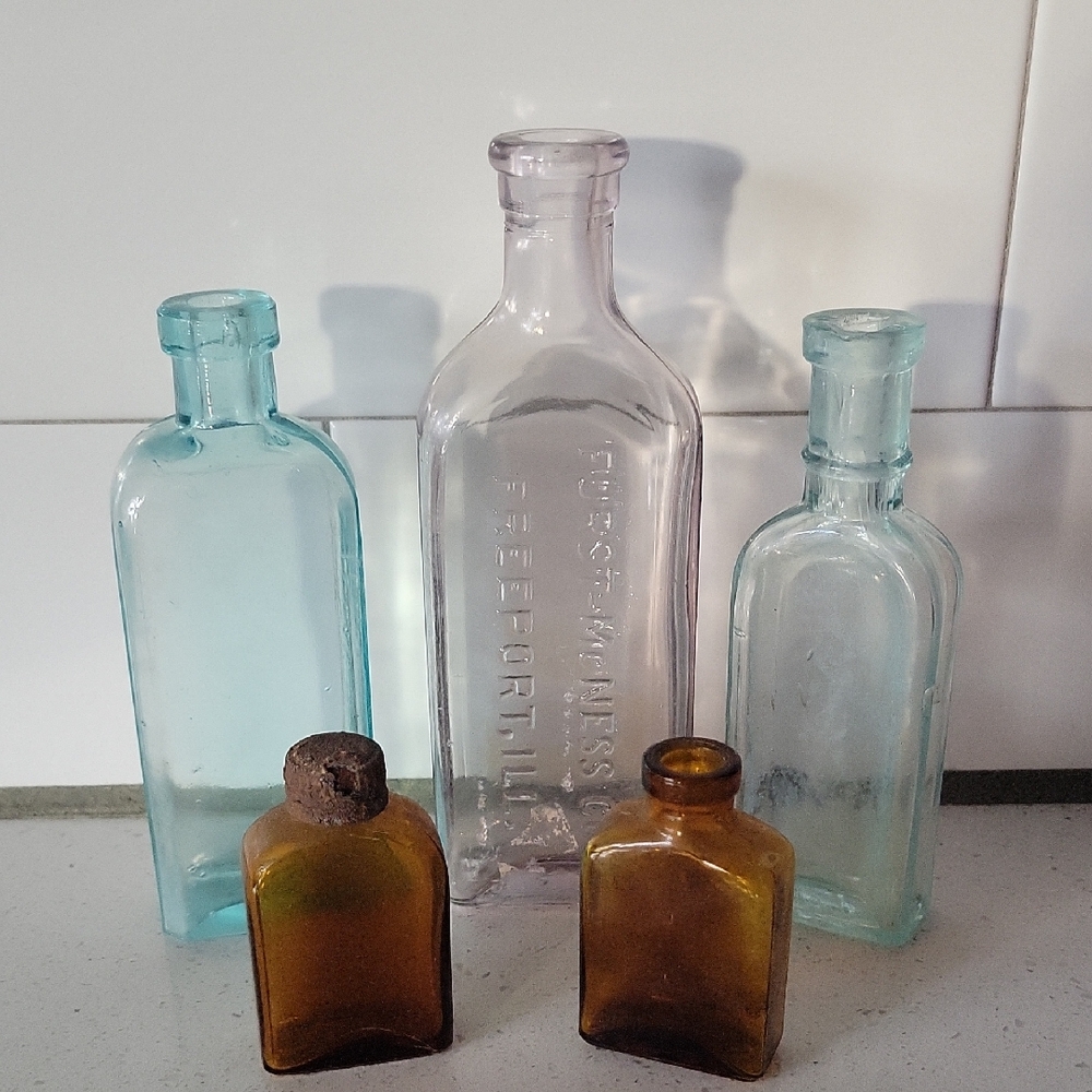 Antique Glass Bottles Furst McNess C.W. Cole Set Of 5 Vintage Purple Blue